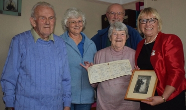 Bill & Bette Duncan, their neighbours Paul & Sylvia Salmon and Sheryll Murray MP holding a wedding photo and the 1951 wedding certificate.